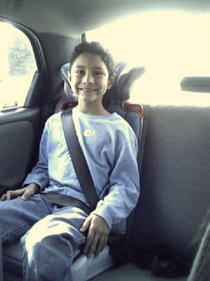 Race in his StarRiser/Comfy Booster. Feb. 2002